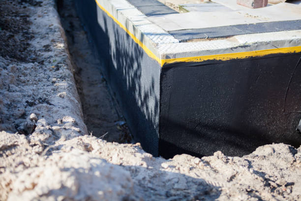 Professional Exterior Waterproofing technician working in Elkhart, KS
